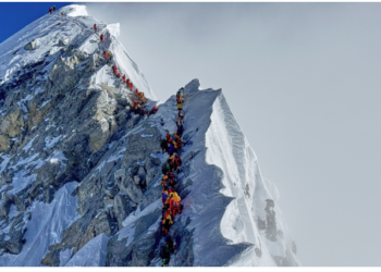 Mount Everest – Climbers queue to reach the 8,849-meter summit